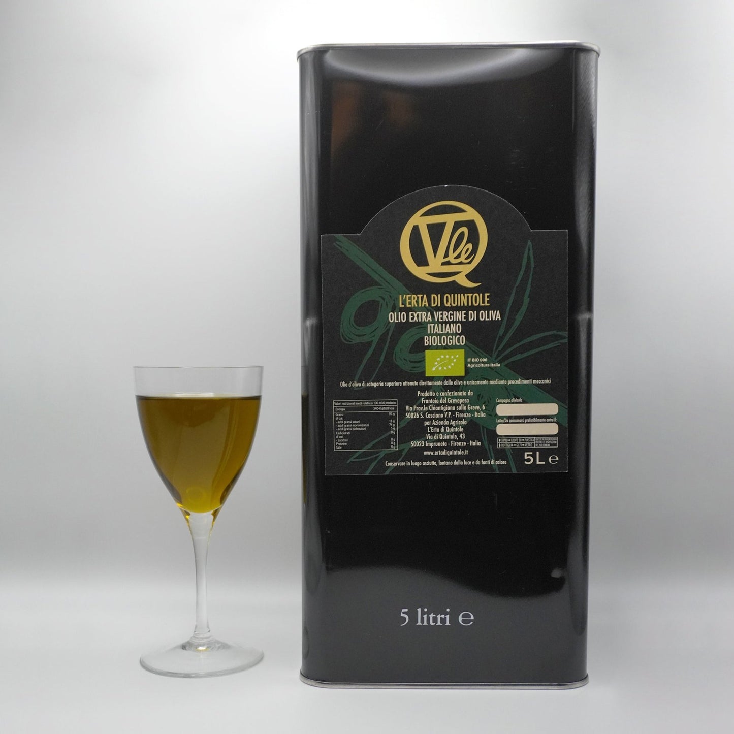 5-liter tin of Italian Organic Extra Virgin Olive Oil next to a full glass of evoo